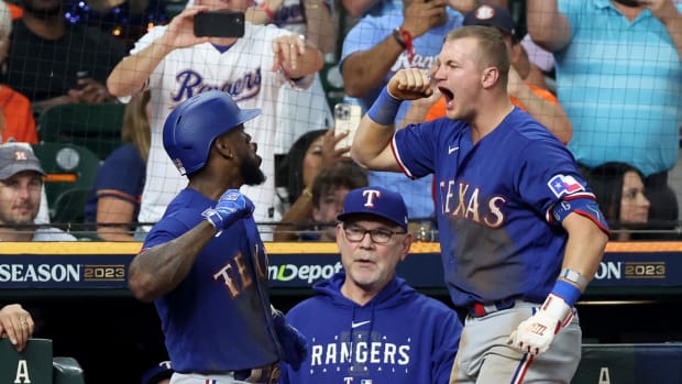 Adolis Garcia, left, celebrates with Josh Jung after hitting a home run in the third inning of Game 7 of the ALCS Monday night at Minute Maid Park in Houston. The Texas Rangers beat the Houston Astros to advance to their first World Series since 2011.